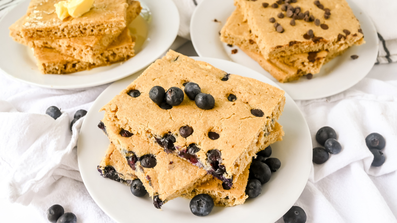 Square of stacked sheet pan pancakes with blueberries